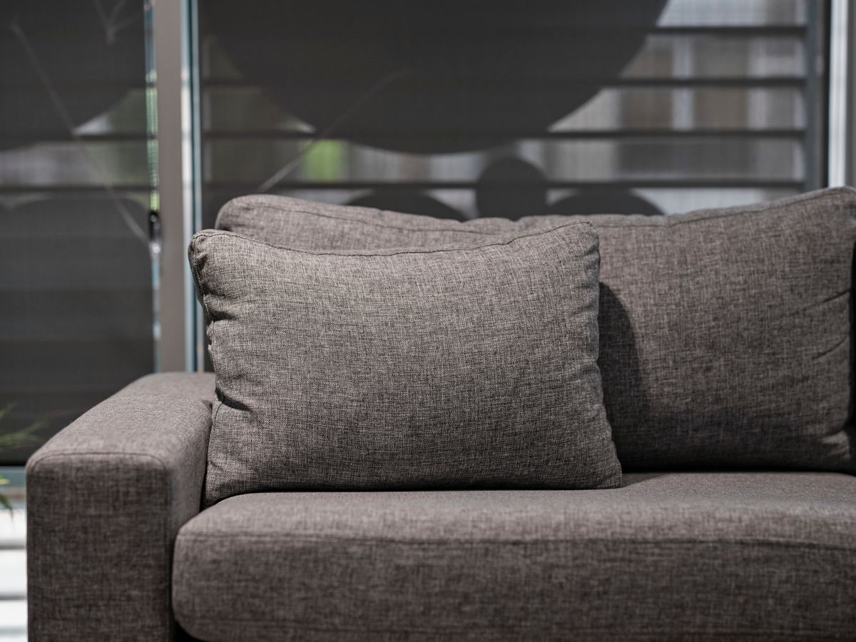 Gray sofa with seat and back cushions