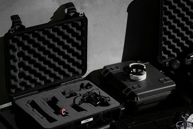 Open hard case with an egg-crate foam lid and cut-out foam inside