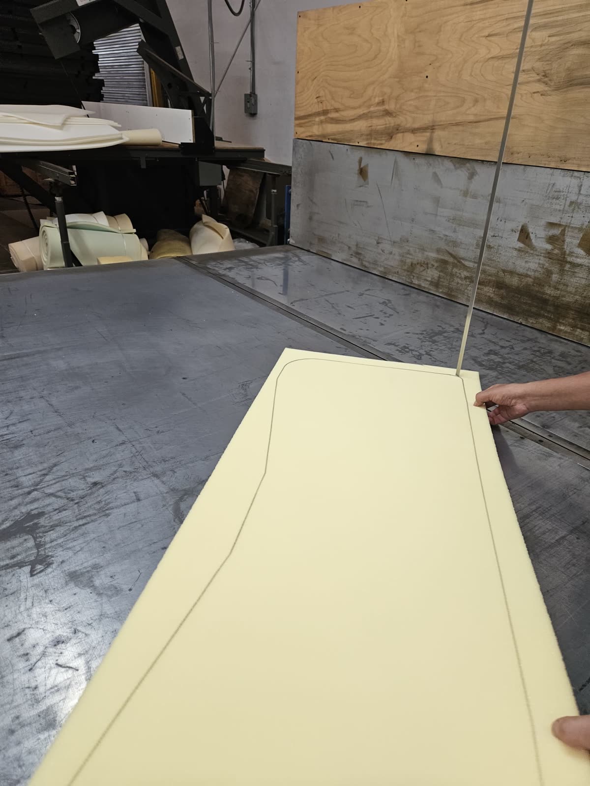 Cutting a custom foam shape on the bandsaw in our shop